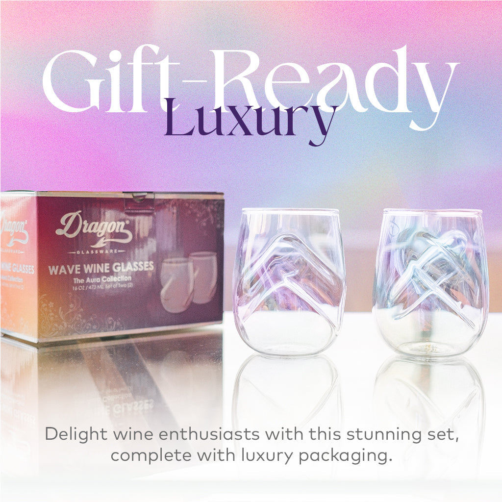 Set of two Aura iridescent stemless wine glasses beside the Dragon Glassware gift box